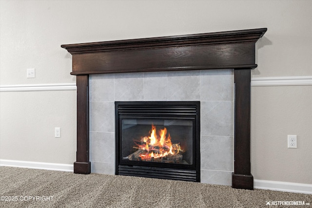 details featuring carpet and a tile fireplace