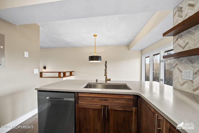 kitchen featuring sink, decorative light fixtures, dishwasher, decorative backsplash, and dark hardwood / wood-style floors