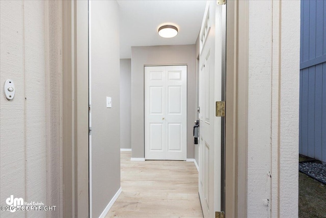 hall with light wood-type flooring