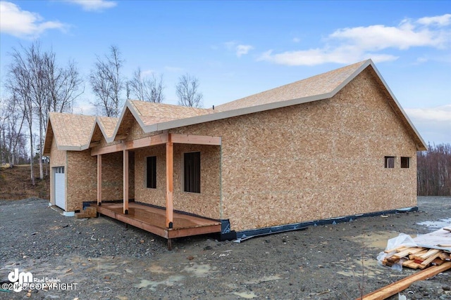 view of side of home featuring a garage