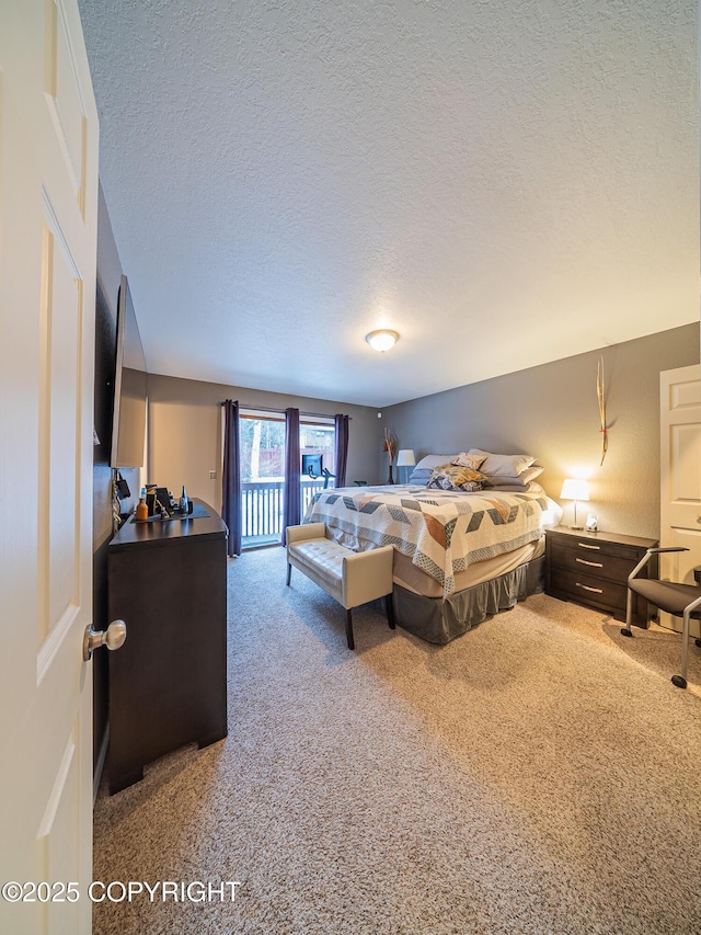 bedroom with a textured ceiling and carpet