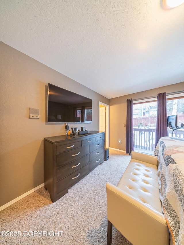 carpeted bedroom featuring a textured ceiling