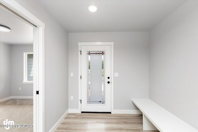 entryway with a textured ceiling and a healthy amount of sunlight