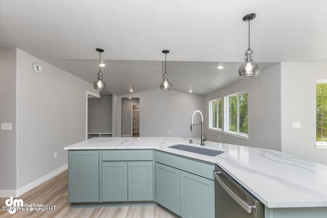 kitchen with light stone counters, dishwasher, vaulted ceiling, a kitchen island, and sink