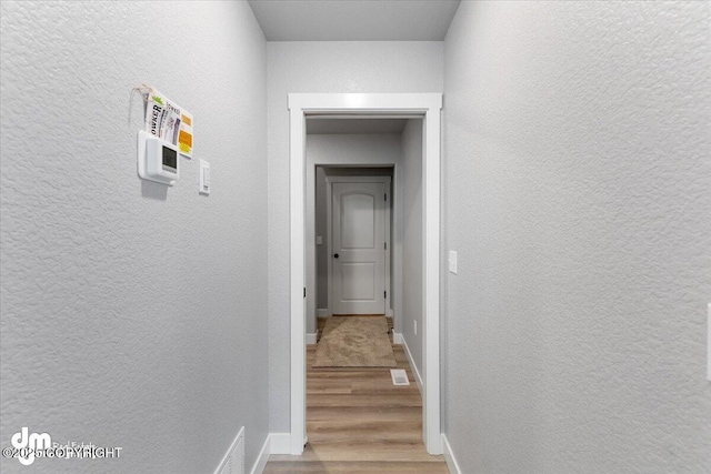 hall featuring hardwood / wood-style flooring