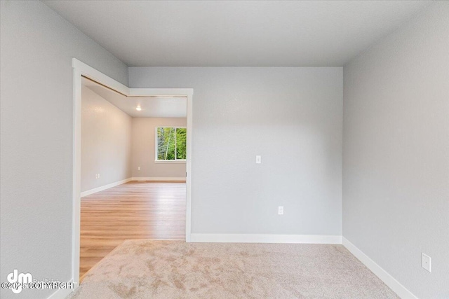 unfurnished room with hardwood / wood-style flooring