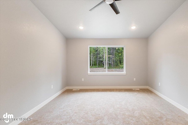 carpeted empty room with ceiling fan