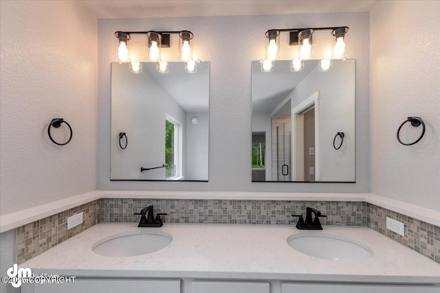 bathroom with vanity and backsplash