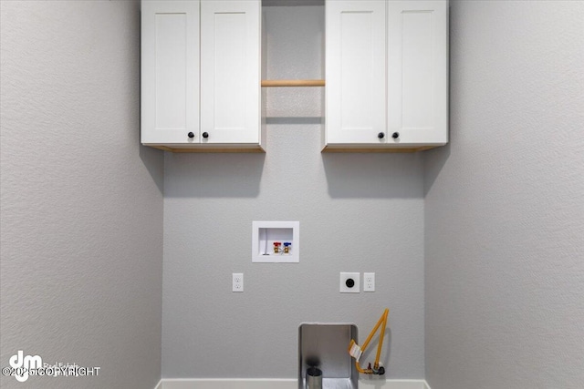 clothes washing area featuring washer hookup, cabinets, and electric dryer hookup