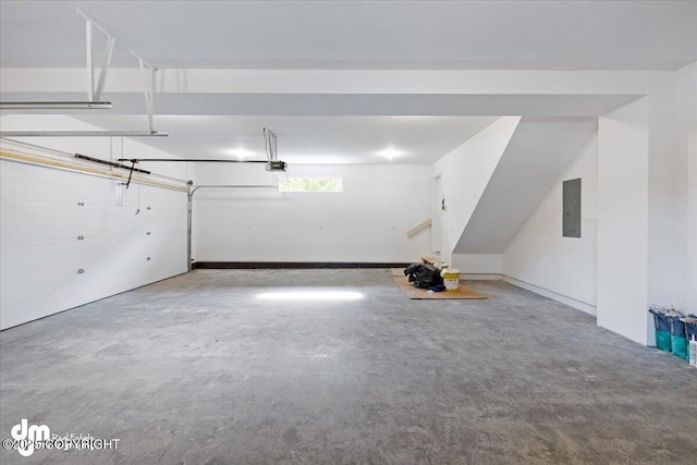 garage featuring electric panel and a garage door opener