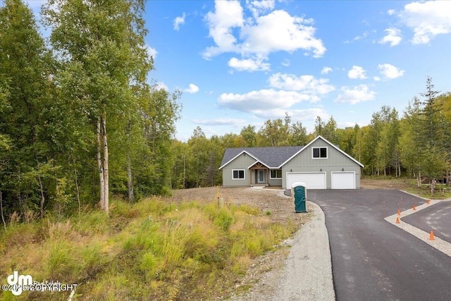 ranch-style home featuring a garage