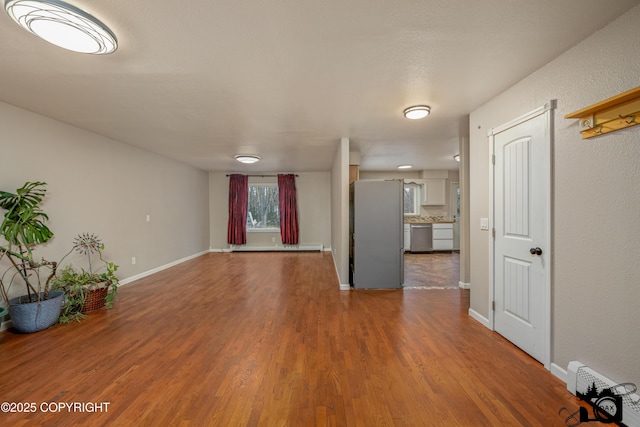 unfurnished living room featuring wood-type flooring