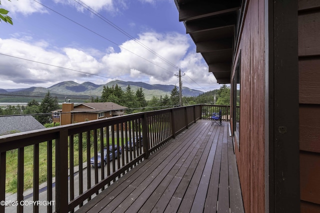 wooden deck featuring a mountain view