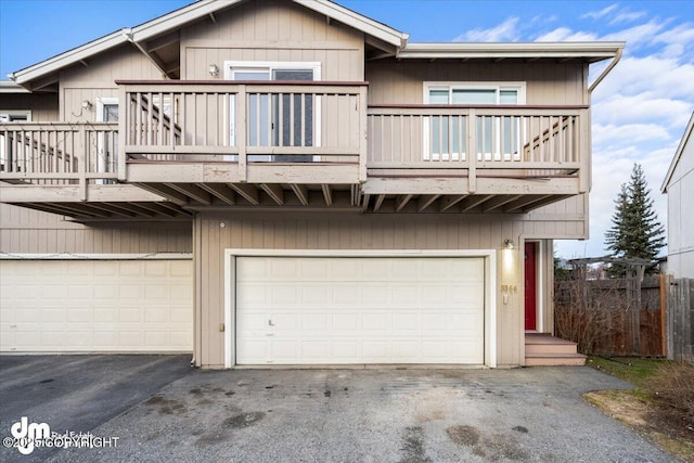 exterior space with a balcony and a garage