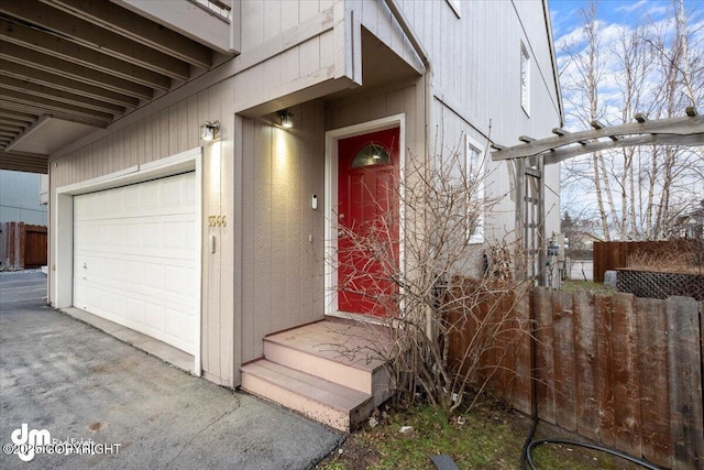 doorway to property featuring a garage