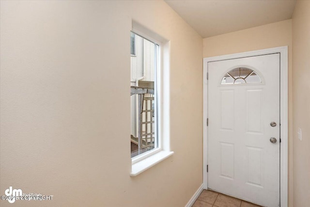 entryway featuring light tile patterned floors