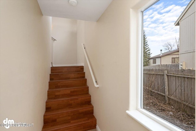 stairway featuring a healthy amount of sunlight