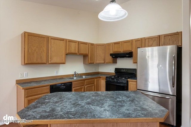 kitchen featuring a high ceiling, decorative light fixtures, black appliances, a kitchen island, and sink