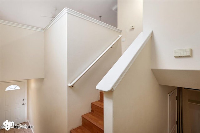 staircase with ornamental molding