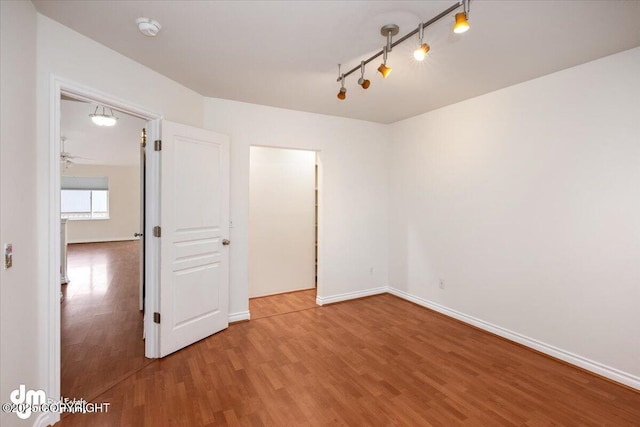 unfurnished bedroom with hardwood / wood-style floors