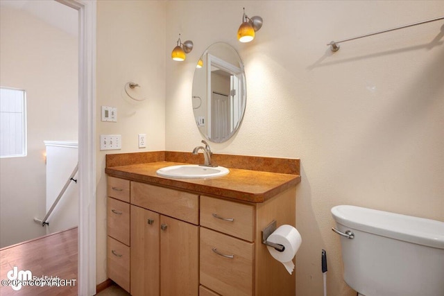 bathroom with vanity and toilet