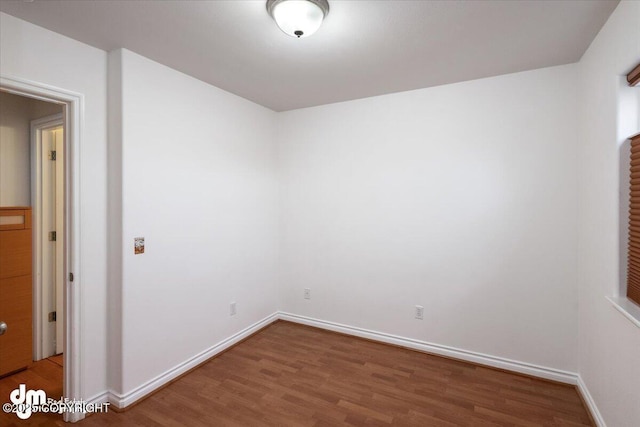 unfurnished room featuring wood-type flooring