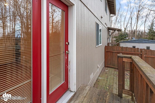 doorway to property featuring a wooden deck