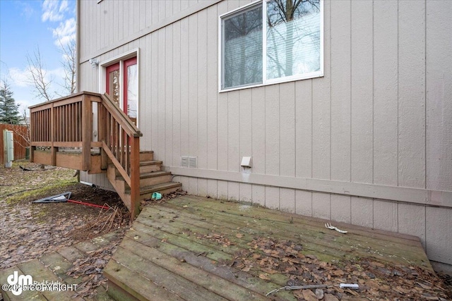 view of property exterior with a wooden deck