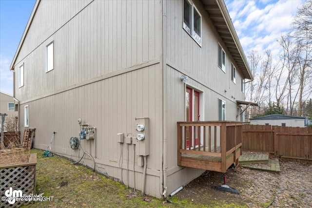 view of property exterior with a deck