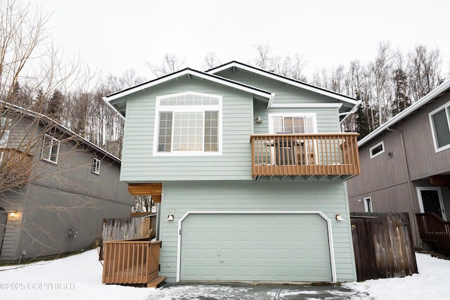 view of front of house featuring a balcony and a garage