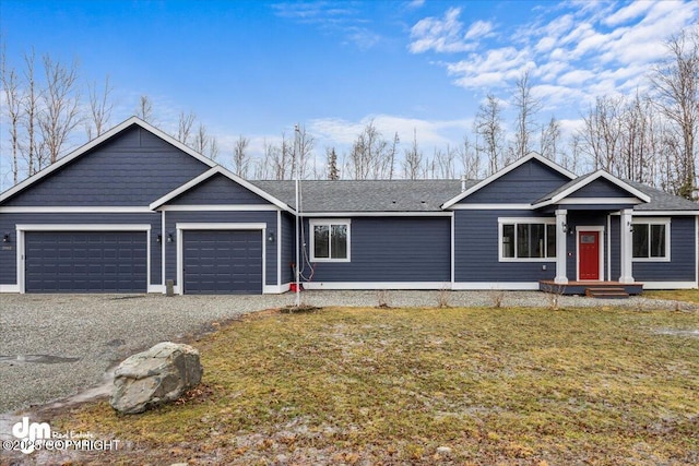 view of front of house with a garage and a front yard