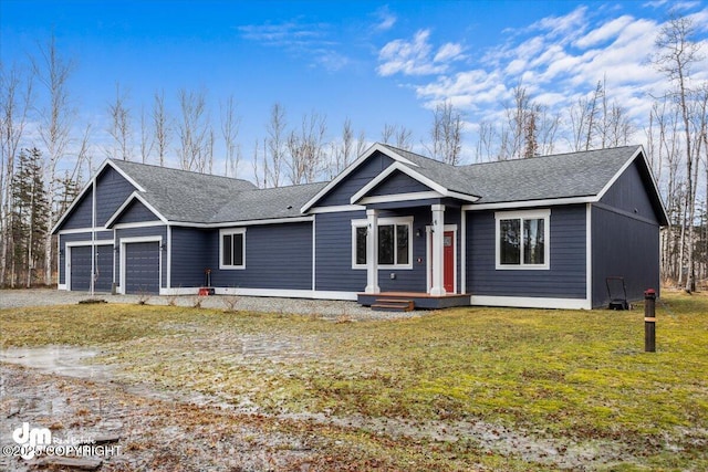 ranch-style house with a garage and a front yard