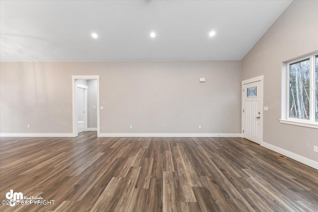 unfurnished living room with dark hardwood / wood-style flooring