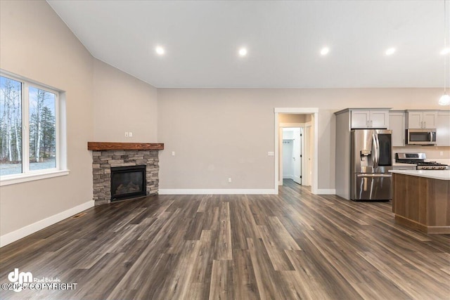 unfurnished living room with dark hardwood / wood-style floors and a fireplace