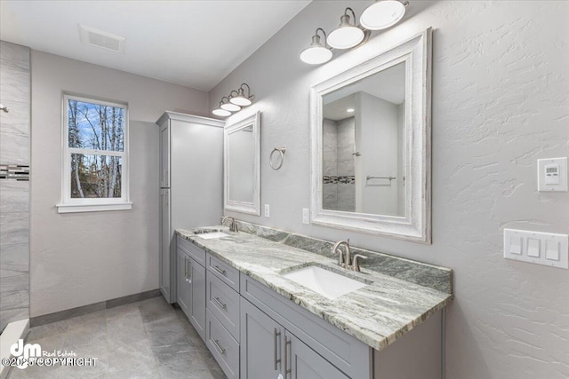 bathroom with vanity and tile patterned flooring