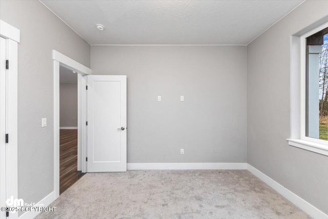 empty room with light colored carpet