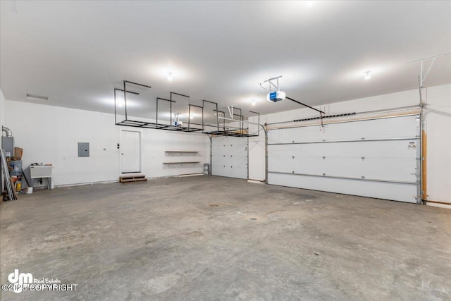 garage with sink, a garage door opener, and electric panel