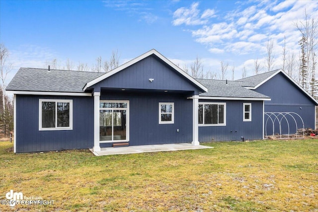 back of property featuring a patio and a lawn