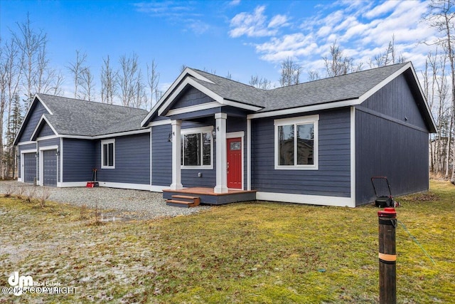 view of front of home featuring a garage and a front yard