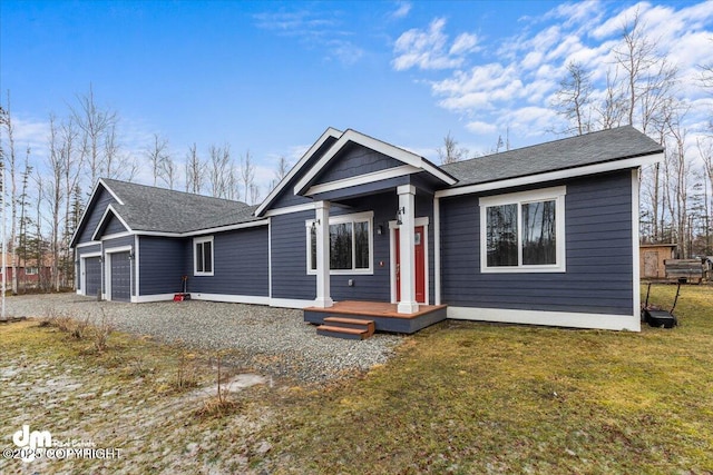 view of front of home with a garage and a front yard