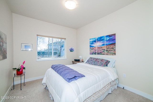 bedroom with light colored carpet