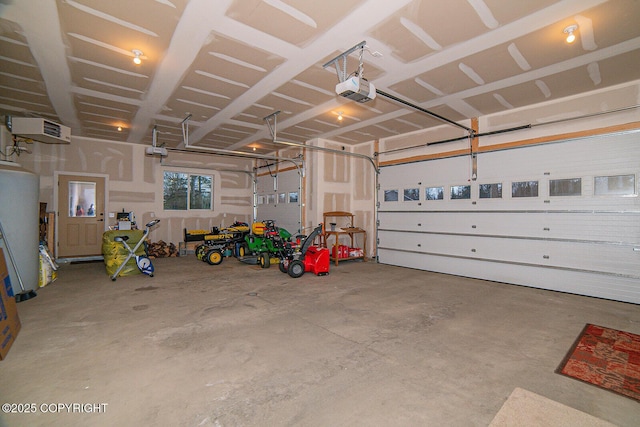 garage with a garage door opener and water heater