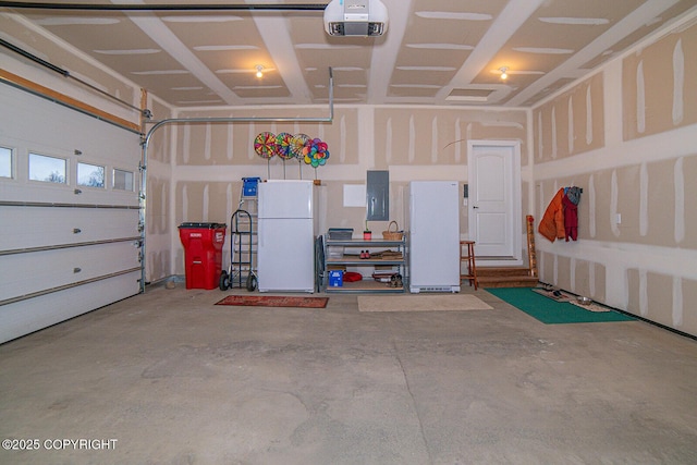 garage with a garage door opener, electric panel, and white fridge