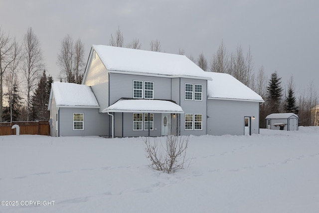 view of front of home with a storage unit