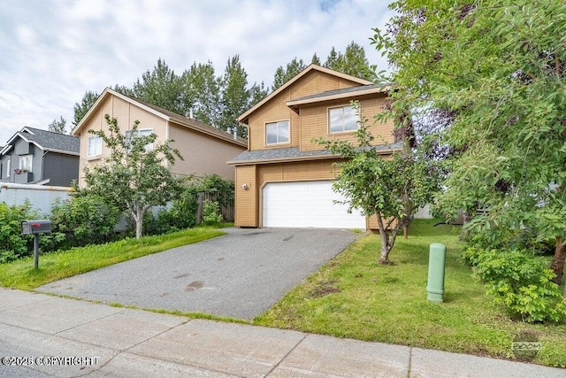 view of front of house with a front lawn and a garage