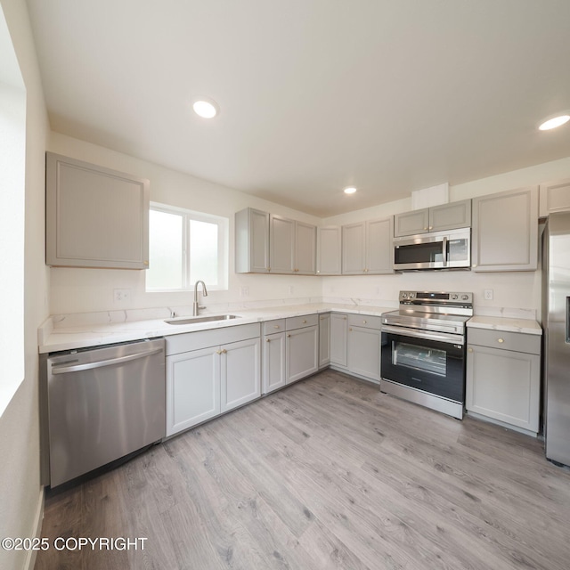 445 Idaho St, Anchorage, AK 99504 - kitchen with stainless steel appliances, gray cabinets, light wood finished floors, light countertops, and recessed lighting
