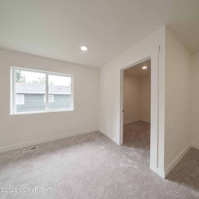445 Idaho St, Anchorage, AK 99504 - spare room featuring light colored carpet and recessed lighting