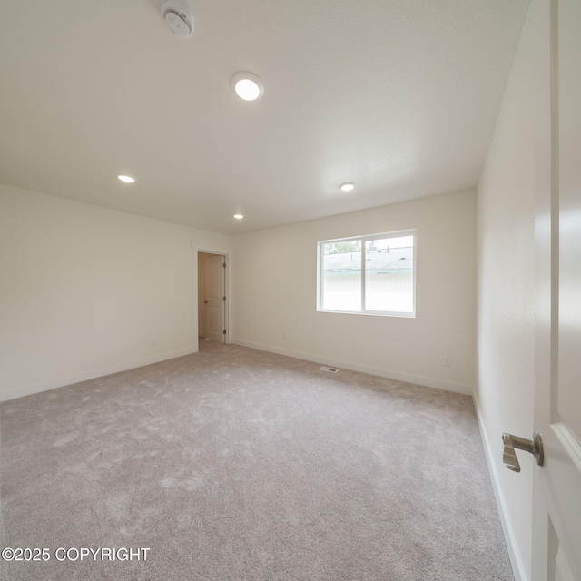 445 Idaho St, Anchorage, AK 99504 - unfurnished room with a smoke detector, carpet, and recessed lighting