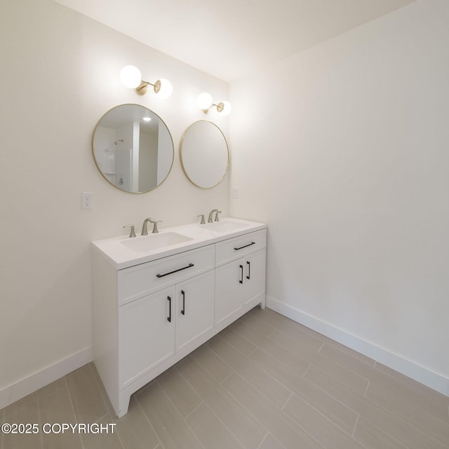 445 Idaho St, Anchorage, AK 99504 - bathroom featuring double vanity and baseboards