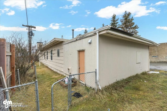 view of home's exterior with a lawn